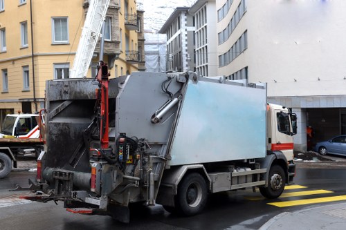 Front view of a commercial waste collection vehicle operating in Loughton